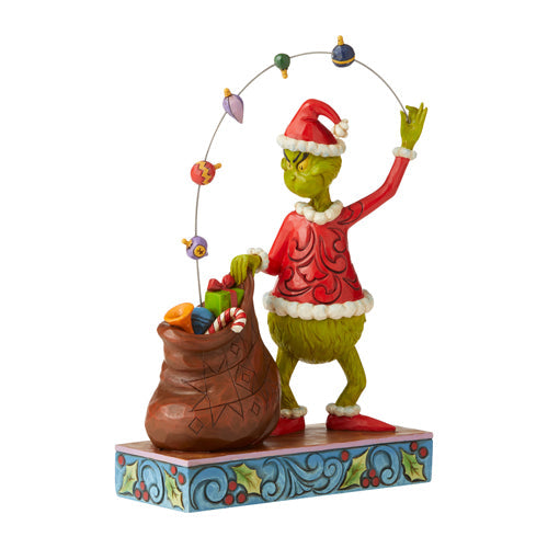 Grinch Juggling Gifts into Bag
