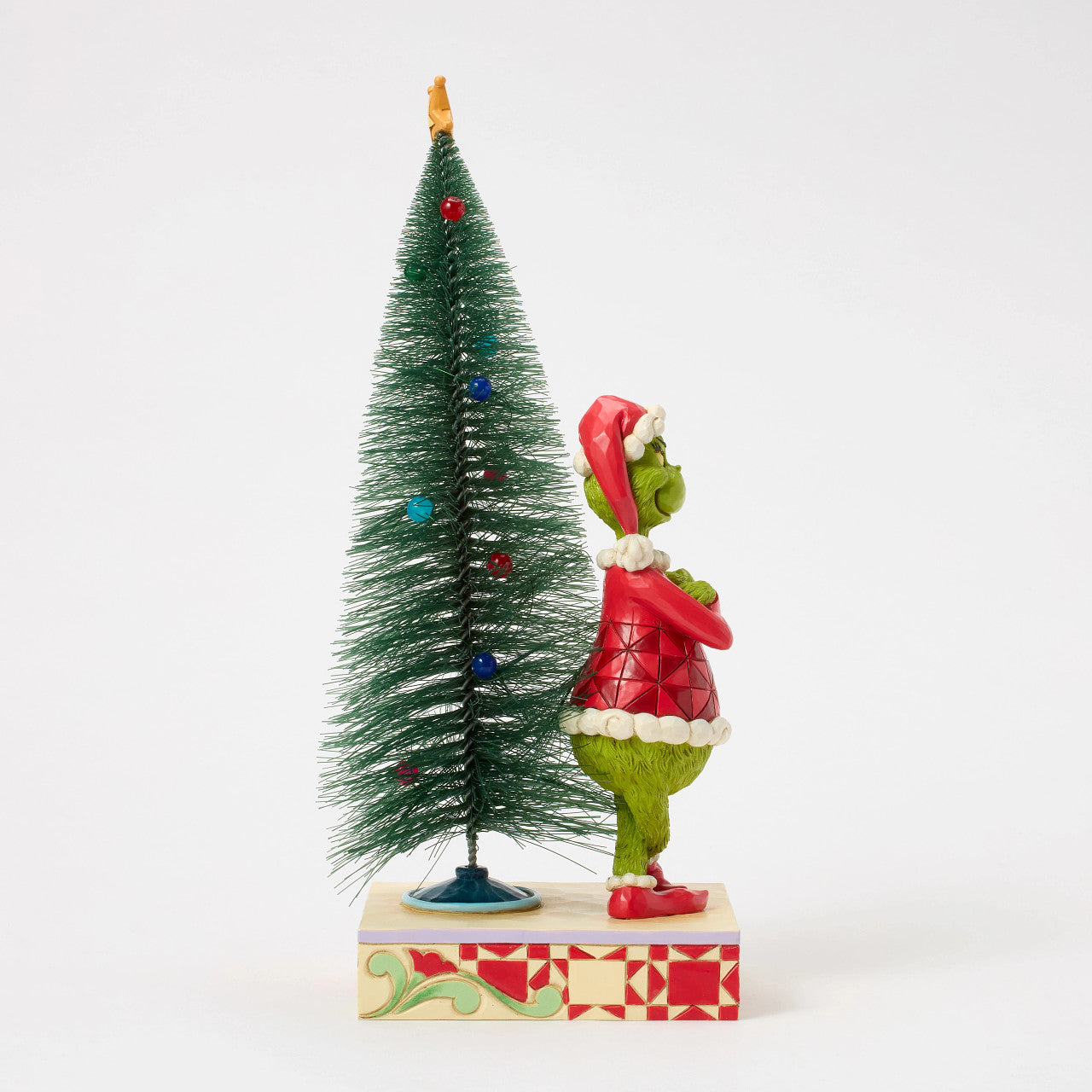 Grinch with Arms Crossed by Christmas Tree