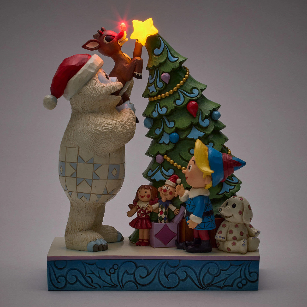Bumble Holding Rudolph by Tree