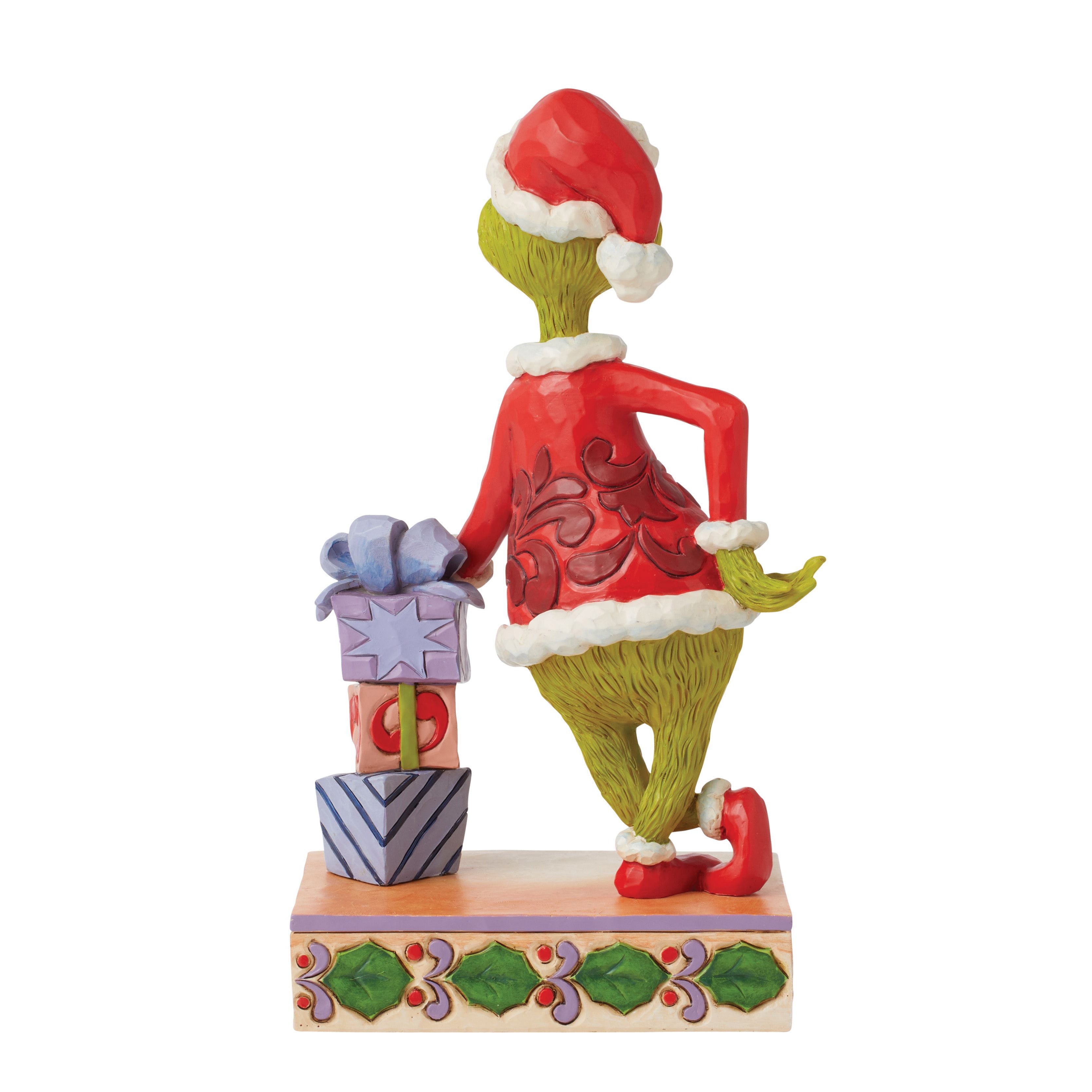Grinch Leaning on Stack of Gifts
