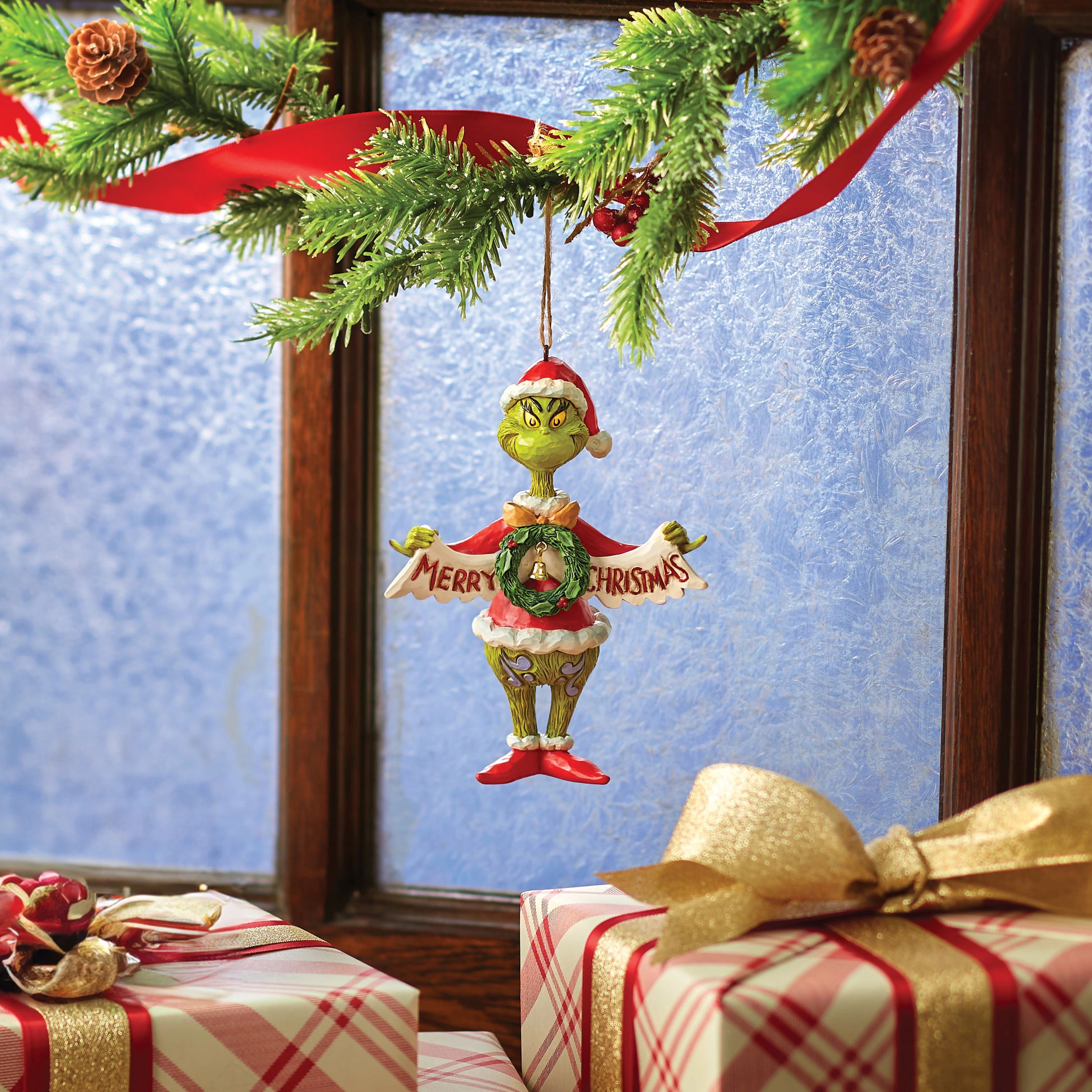 Grinch Holding Merry Christmas Banner